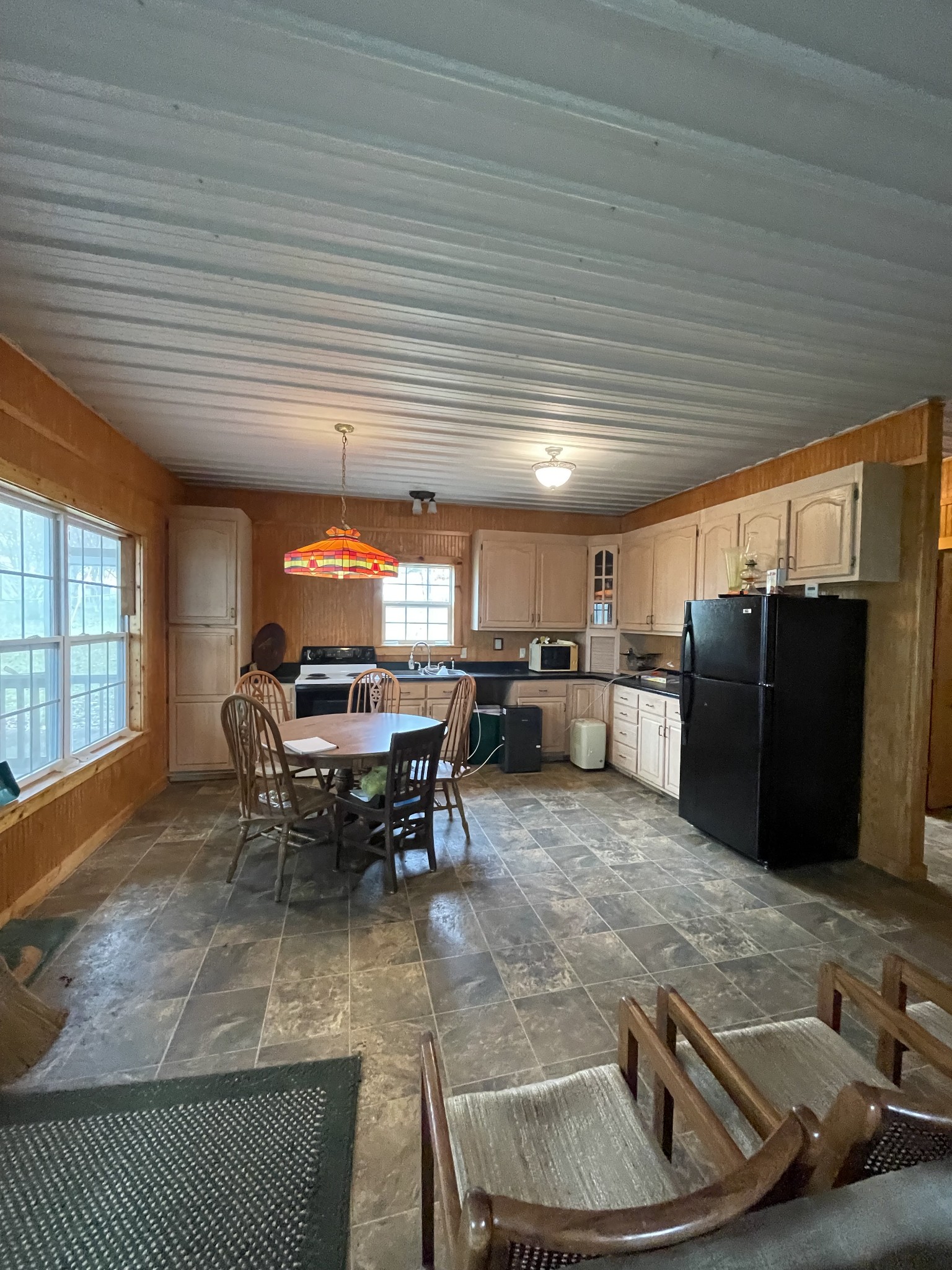 1733 Pump Station Road New Johnsonville, TN 37134 - Photo 9 of 20 a living room with furniture a window and stainless steel appliances