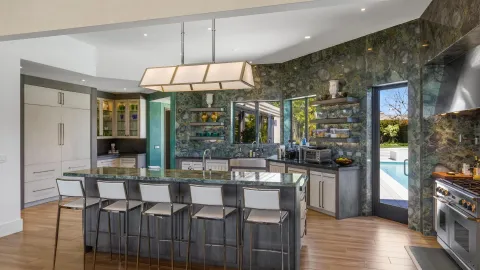 a view of a chairs and table in patio