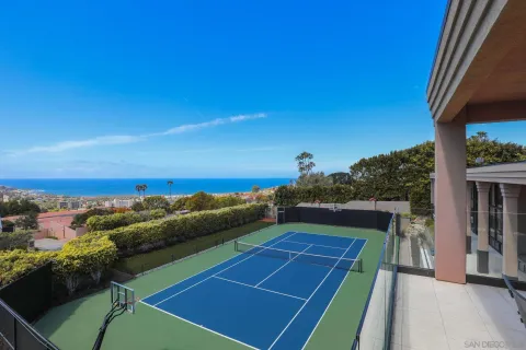 a living room with furniture a fireplace and a table