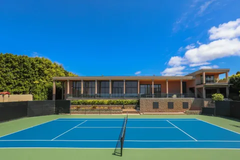 an aerial view of an house with swimming pool and lake view