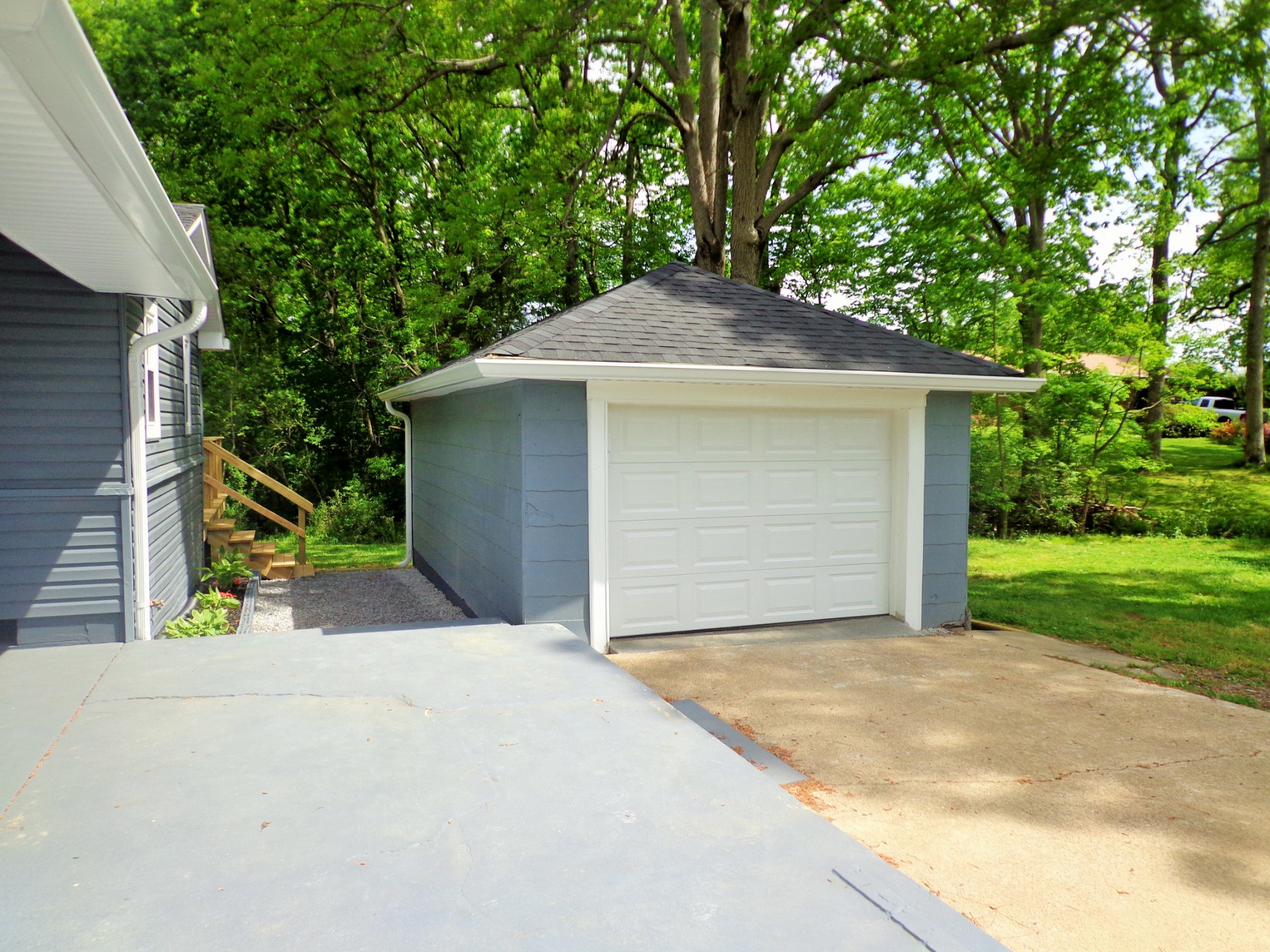 320 Old Stewart Road Tennessee Ridge, TN 37178 - Photo 6 of 34 a front view of a house with a yard and garage