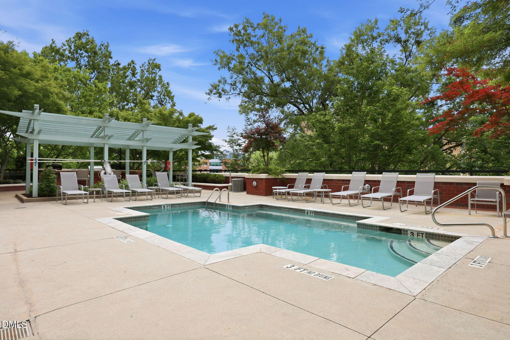 618 North Boylan Avenue, Unit 718 Raleigh, NC 27603 - Photo 24 of 38 a view of a swimming pool with a lounge chair