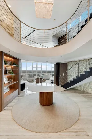 a kitchen that has a sink and a stove in it