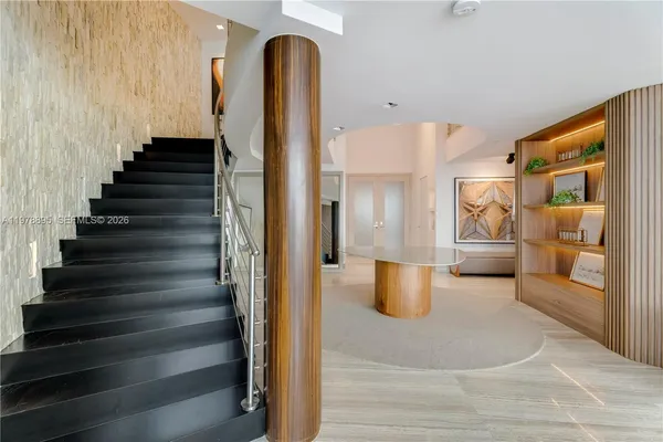 a dining room with furniture and window