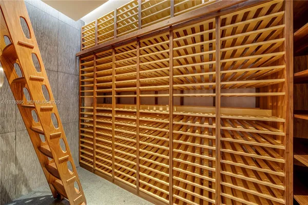 a kitchen with a table chairs stove and glass door