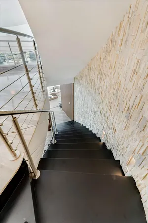 a view of a house with swimming pool in front of it