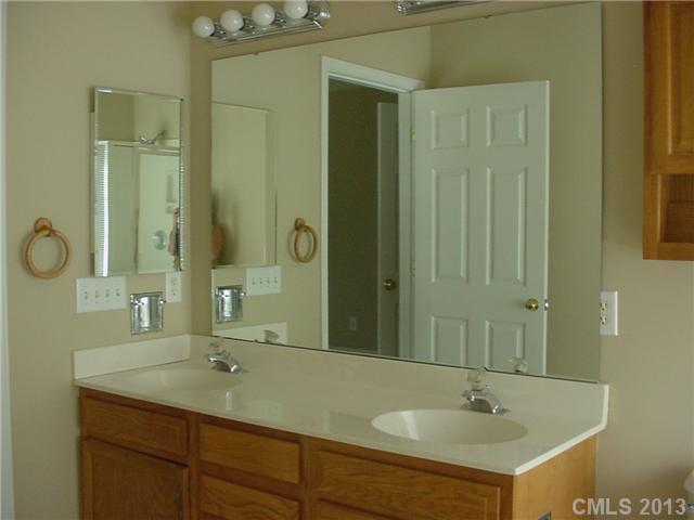6635 Reedy Creek Road, Unit 25 Charlotte, NC 28215 - Photo 8 of 16 a bathroom with a sink and a mirror