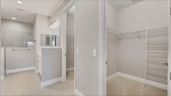 a bathroom with a sink double vanity and a mirror
