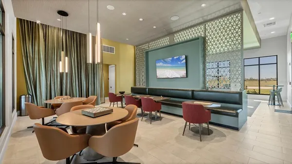 a bathroom with a granite countertop sink a mirror and a shower