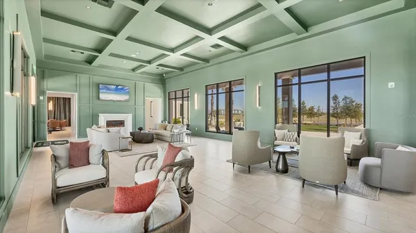 a view of a livingroom with furniture and a ceiling fan