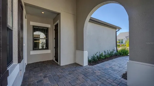 a view of a hallway with wooden walls and plants