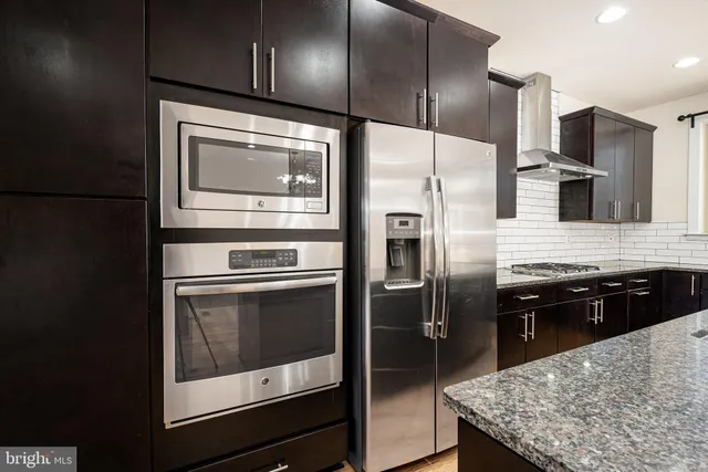 a kitchen with a table and chairs