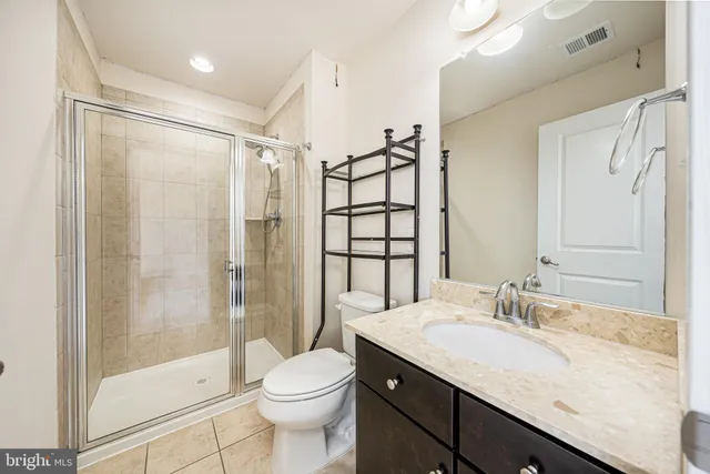 an aerial view of a houses with swimming pool