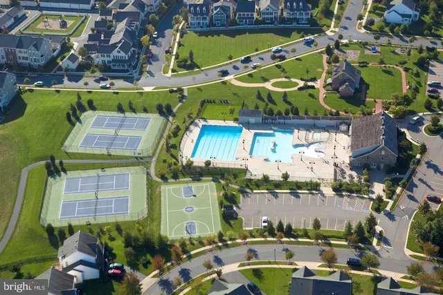 a view of a swimming pool with a yard