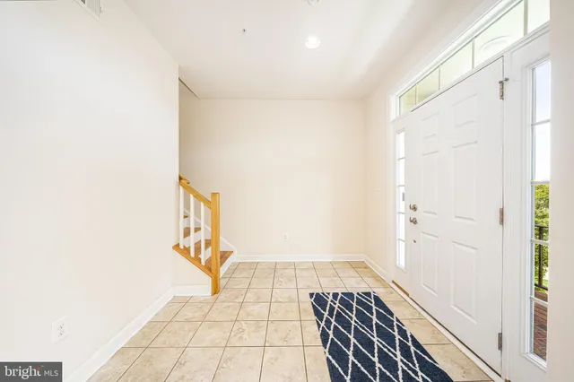 a bathroom with a toilet a sink a mirror and a shower