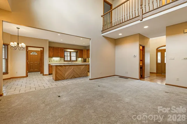 a view of a hallway with wooden shelves