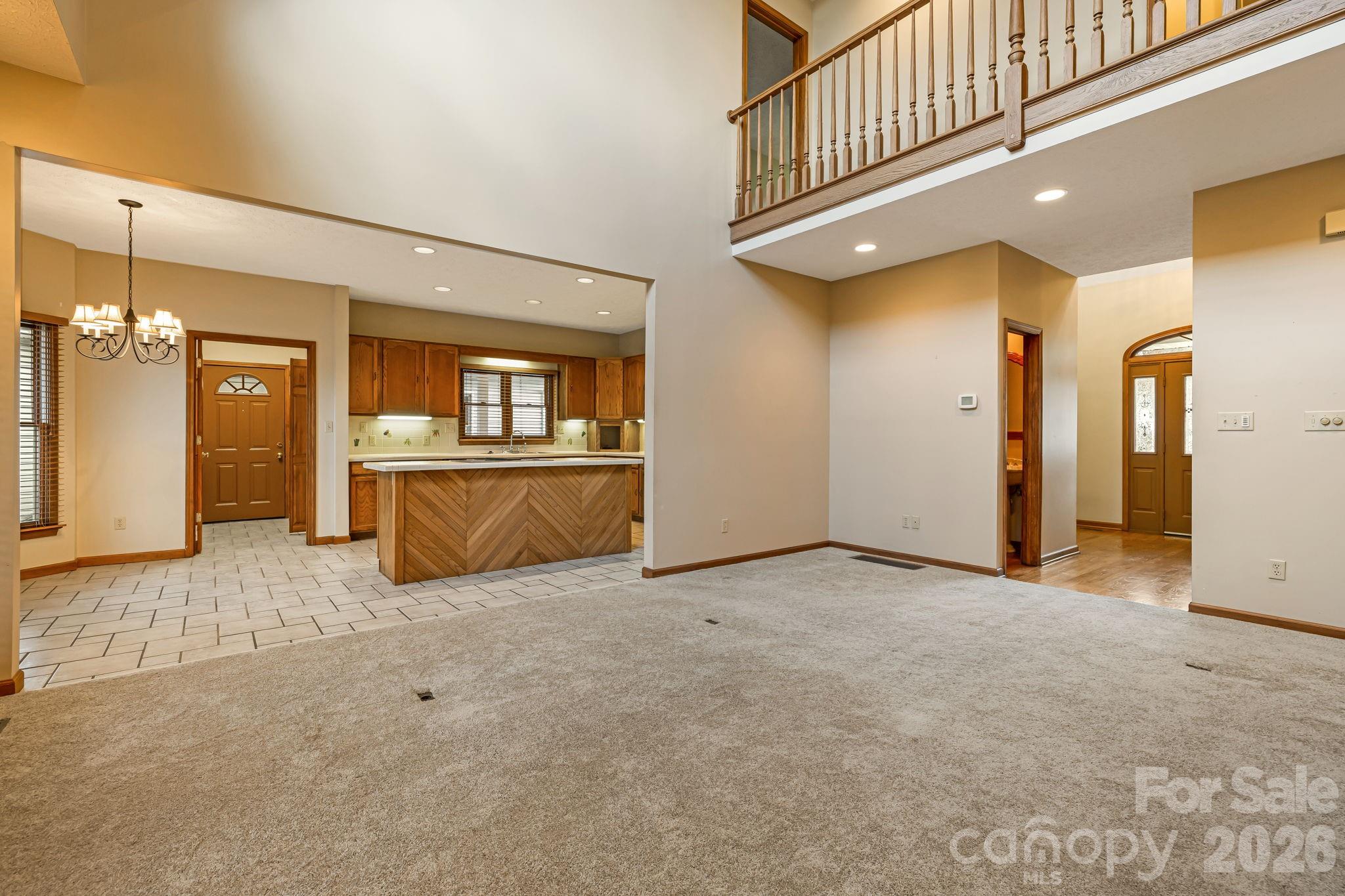 427 McCoy Cove Road Black Mountain, NC 28711 - Photo 12 of 47 a view of a hallway with wooden shelves
