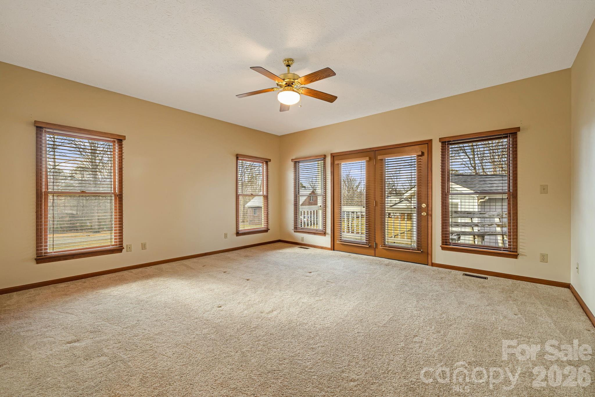 427 McCoy Cove Road Black Mountain, NC 28711 - Photo 20 of 47 a view of an empty room with a window and a kitchen