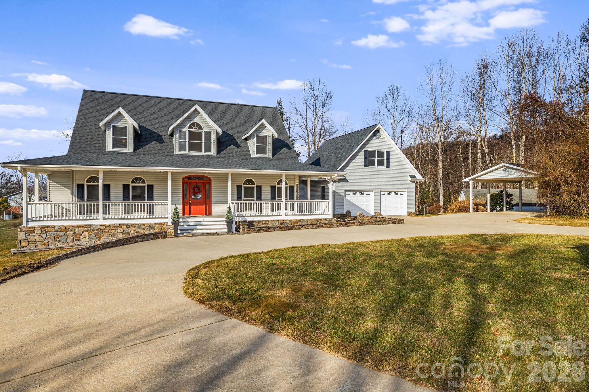 427 McCoy Cove Road Black Mountain, NC 28711 - Photo 2 of 47 a front view of a house with a garden