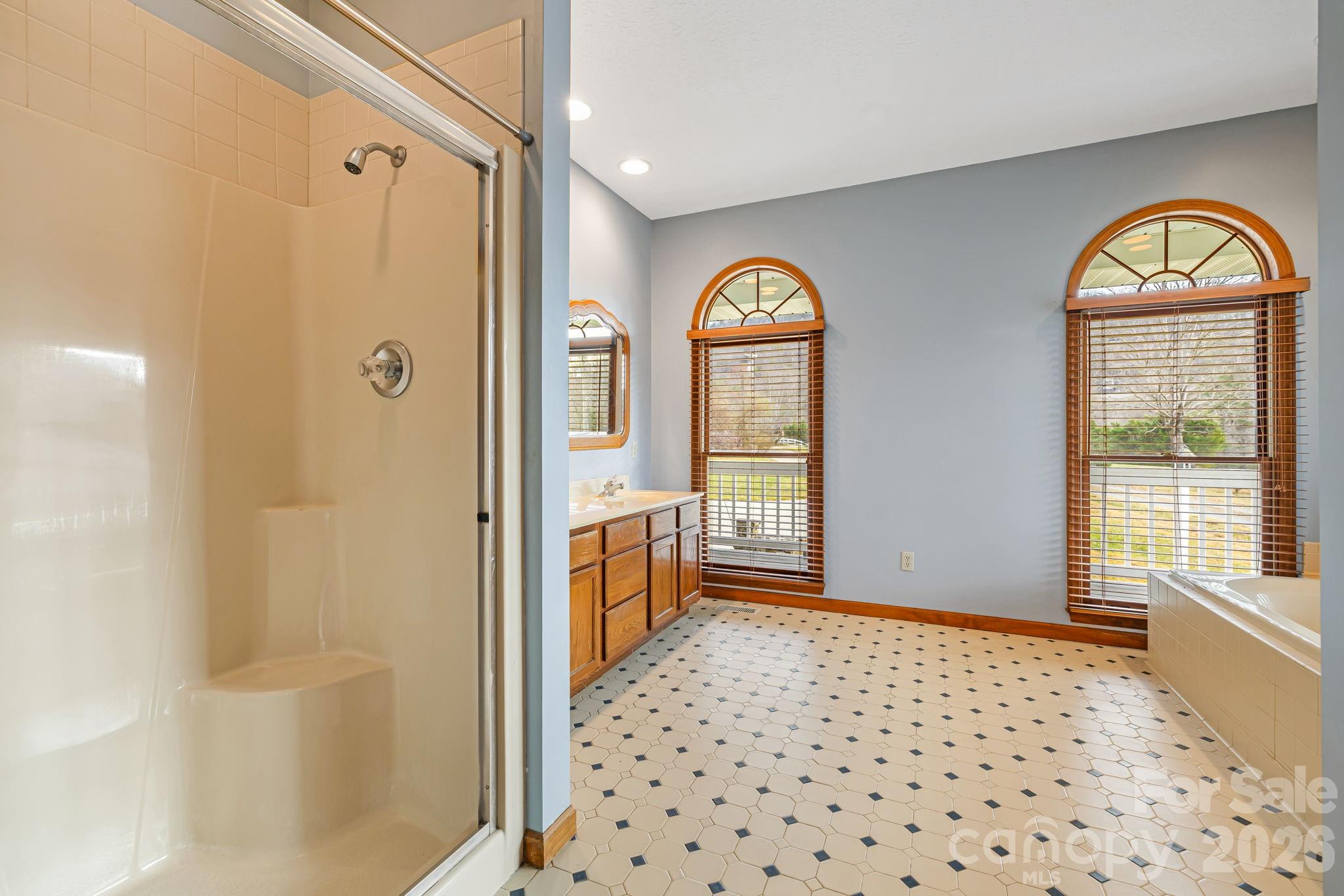 427 McCoy Cove Road Black Mountain, NC 28711 - Photo 22 of 47 a view of a hallway with wooden floor and a livingroom