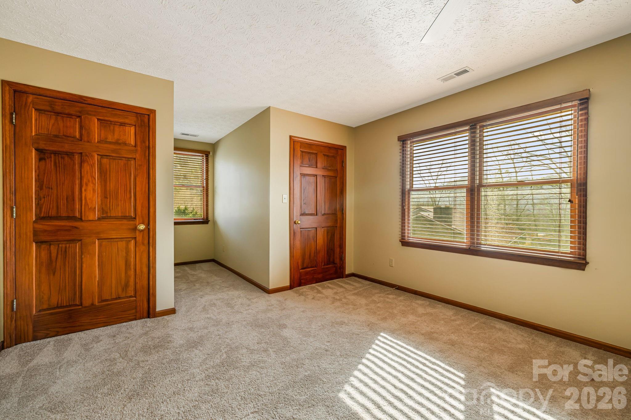 427 McCoy Cove Road Black Mountain, NC 28711 - Photo 25 of 47 an empty room with windows and closet