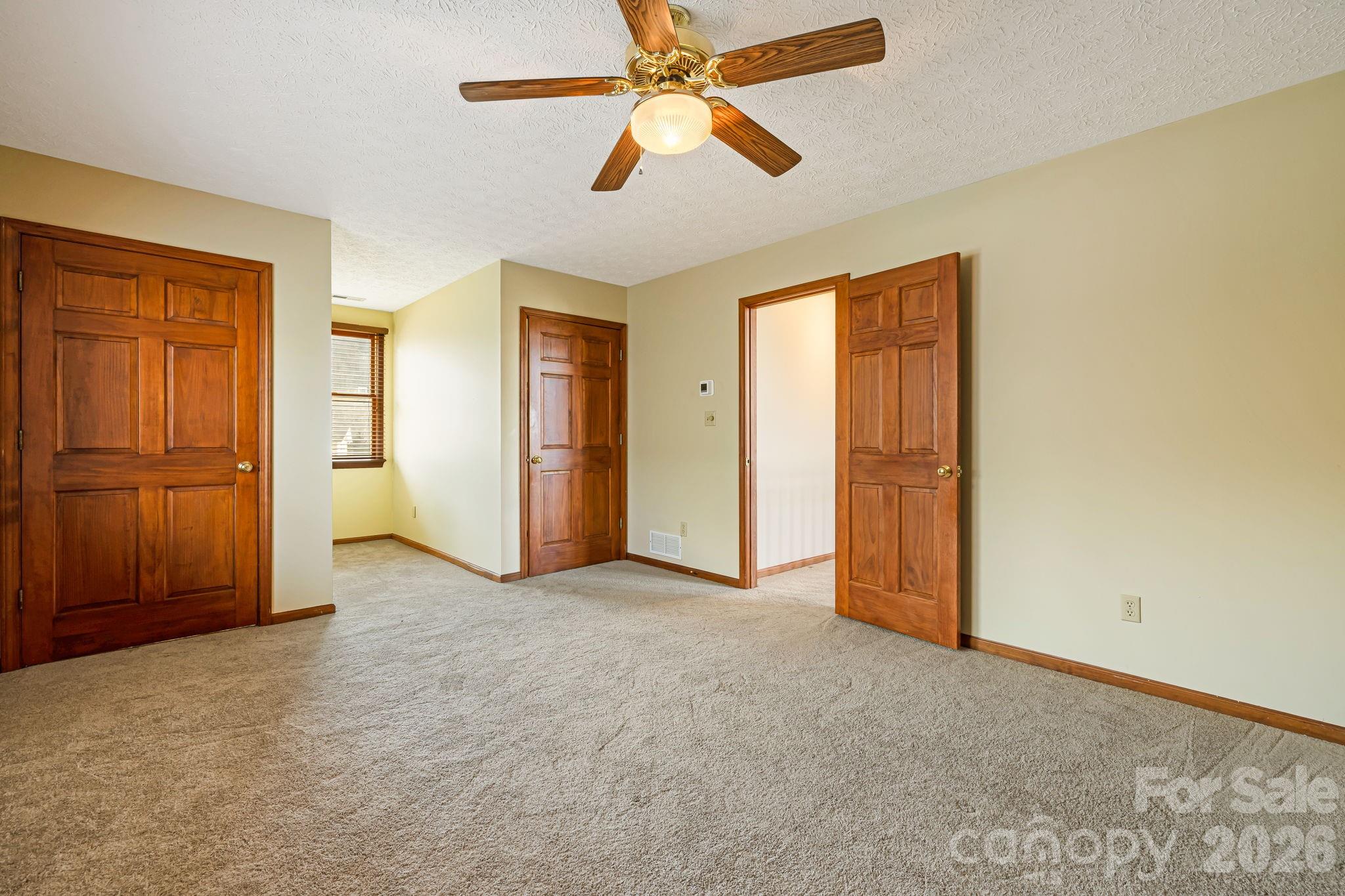 427 McCoy Cove Road Black Mountain, NC 28711 - Photo 28 of 47 an empty room with closet and windows
