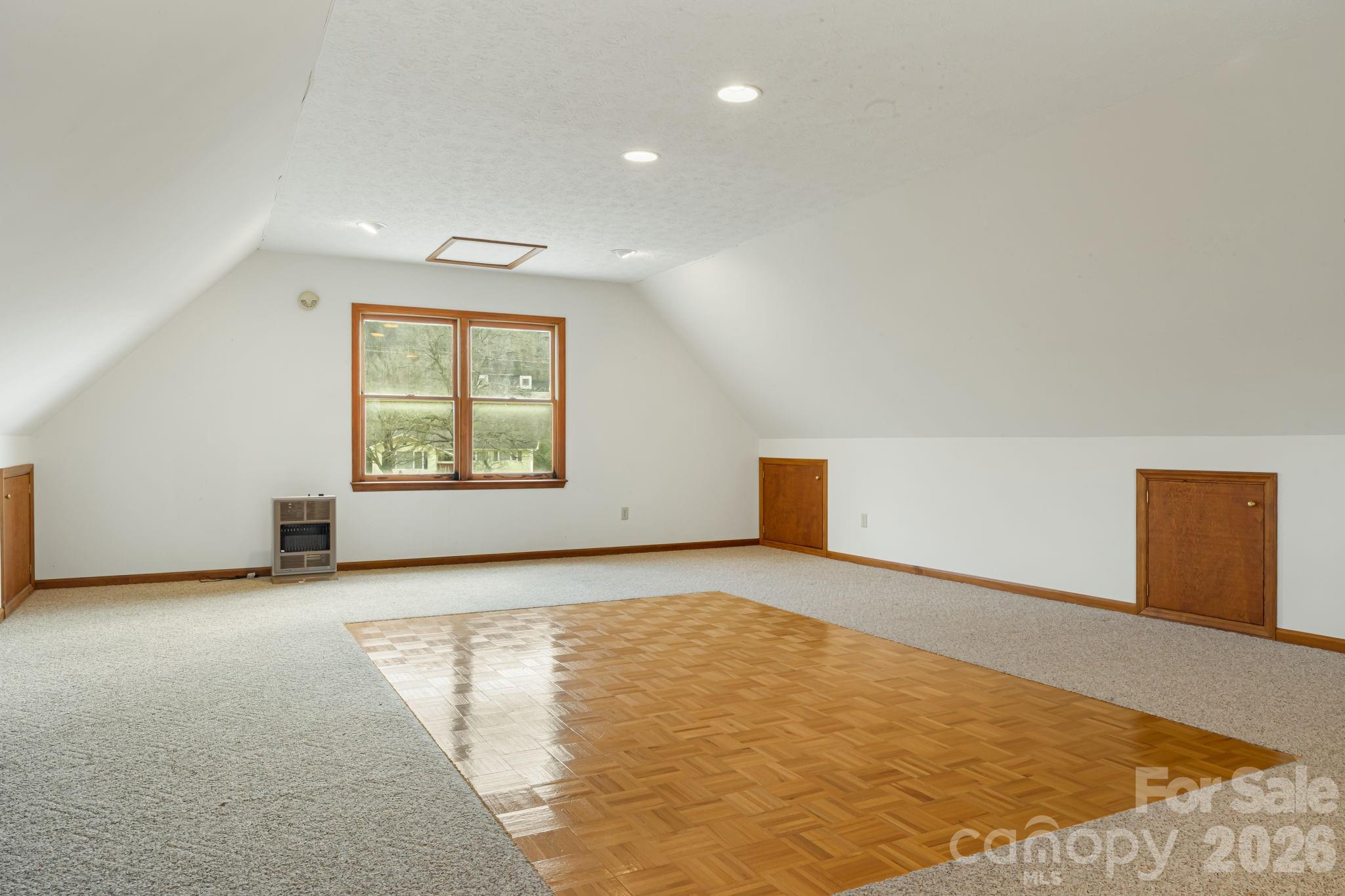 427 McCoy Cove Road Black Mountain, NC 28711 - Photo 32 of 47 an empty room with windows and closet