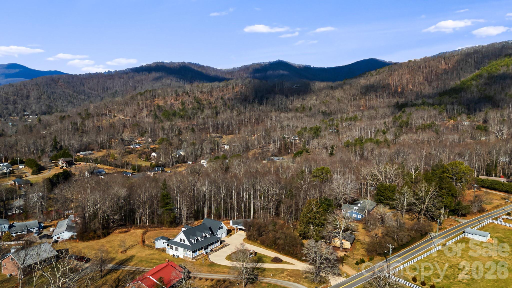 427 McCoy Cove Road Black Mountain, NC 28711 - Photo 42 of 47 a view of a house with a mountain and a forest
