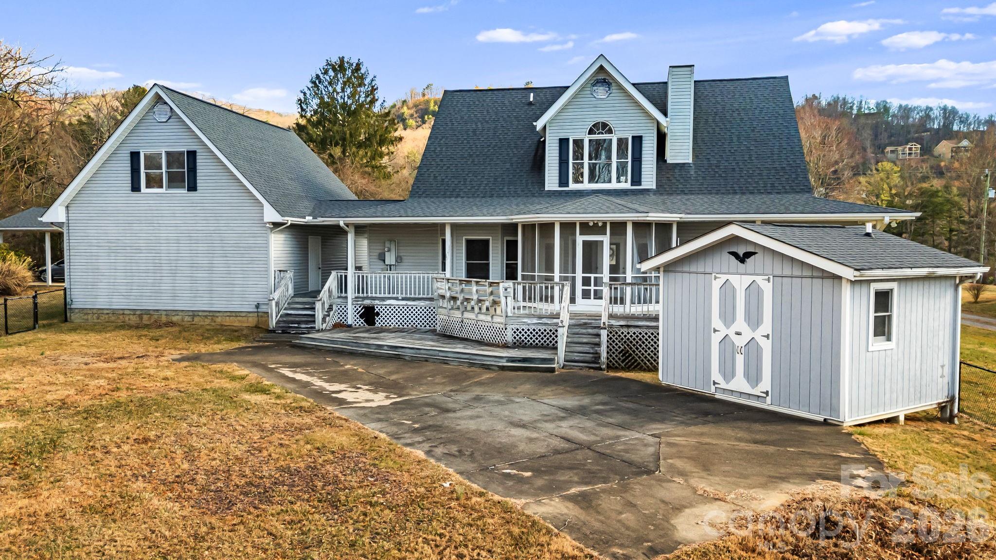 427 McCoy Cove Road Black Mountain, NC 28711 - Photo 46 of 47 a front view of a house with a yard and garage