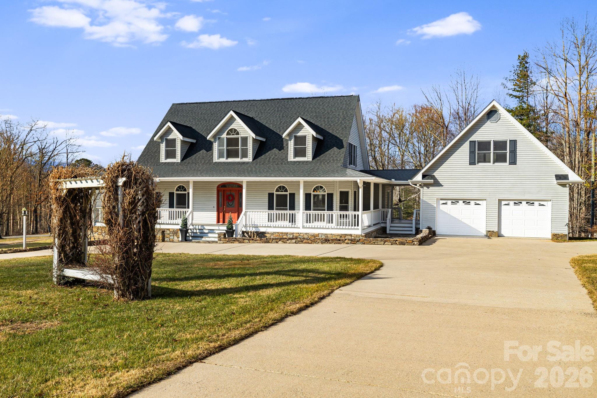 427 McCoy Cove Road Black Mountain, NC 28711 - Photo 5 of 47 a front view of a house with a yard table and chairs