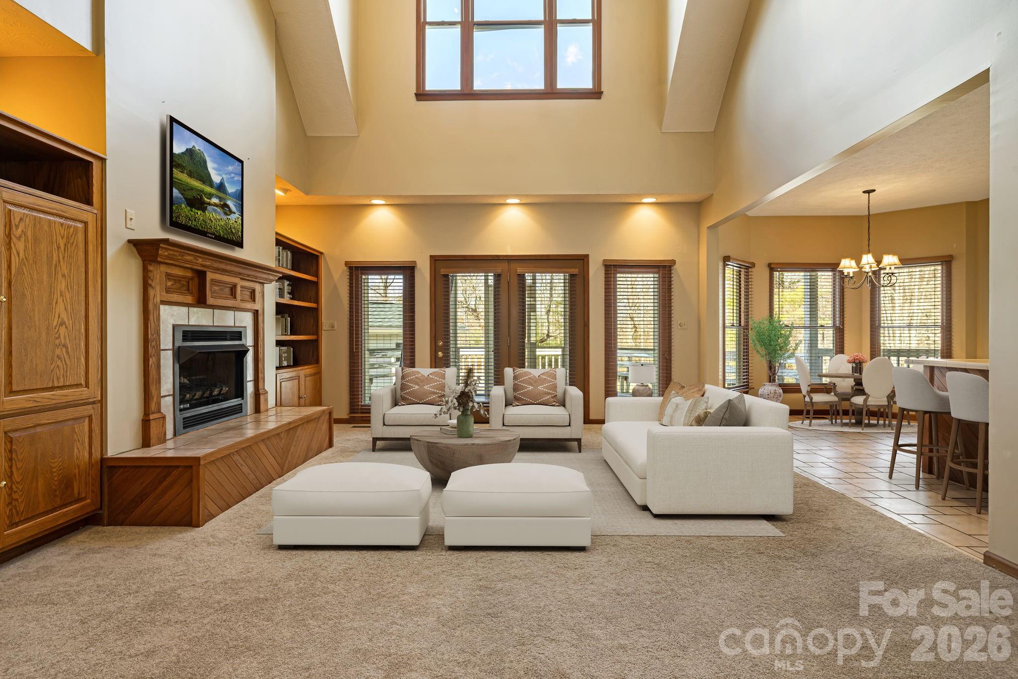 427 McCoy Cove Road Black Mountain, NC 28711 - Photo 8 of 47 a living room with furniture a large window and a fireplace