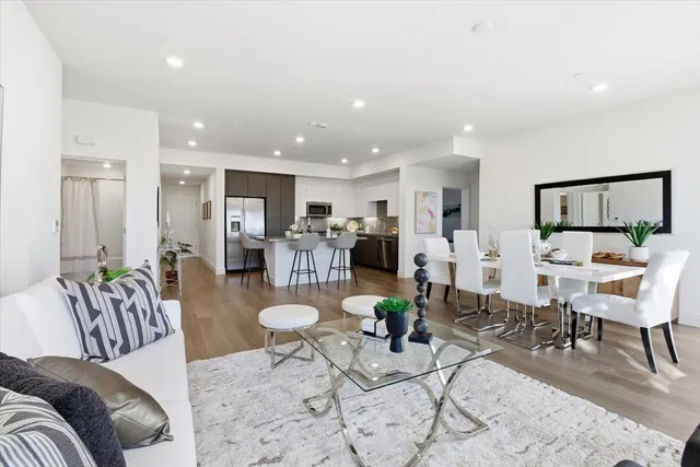 a view of a dining room with furniture window and wooden floor