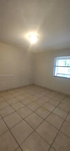 a view of a room that has a window in it