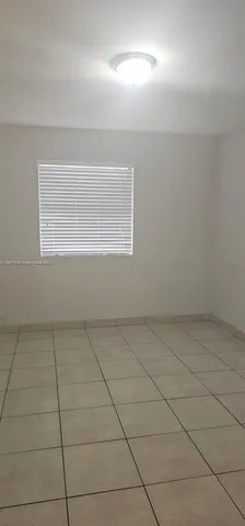 a view of a livingroom with a staircase