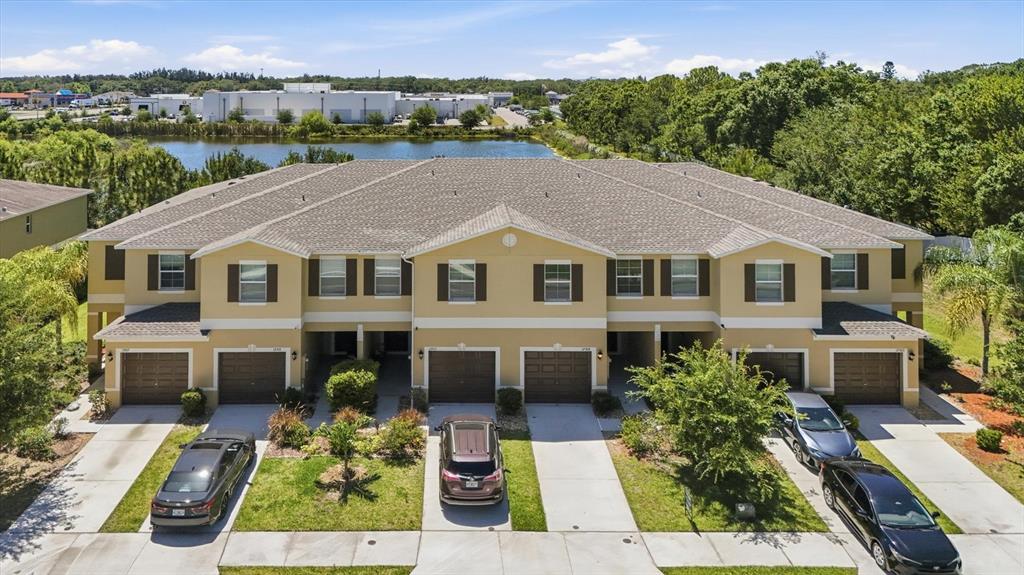 12909 Dream Catcher Way Riverview, FL 33579 - Photo 1 of 32 a aerial view of a house with a yard table and chairs