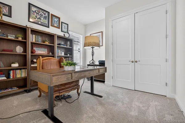 a view of a workspace with bookshelf