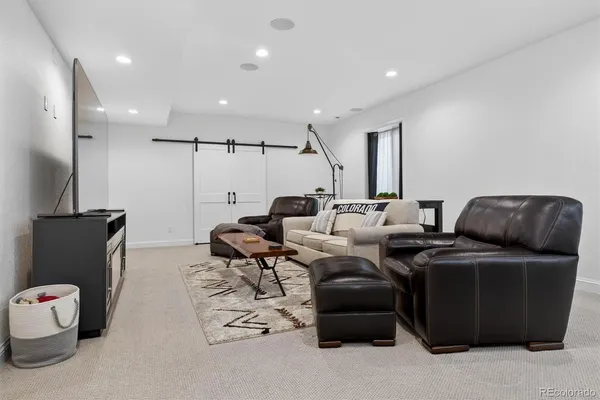 a room with furniture and a flat screen tv