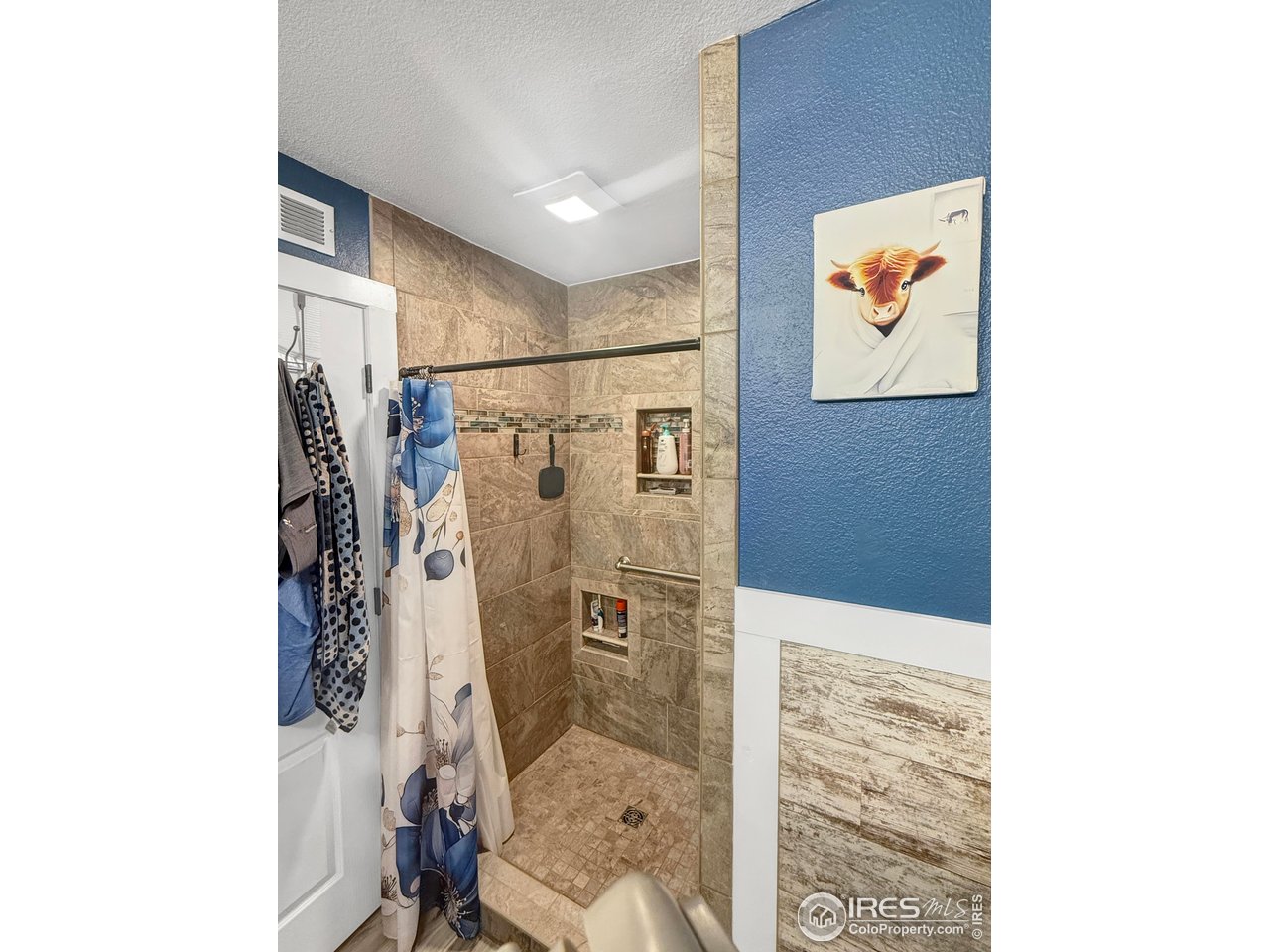 14971 Bluestem Street Sterling, CO 80751 - Photo 17 of 33 a bathroom with a shower and a sink