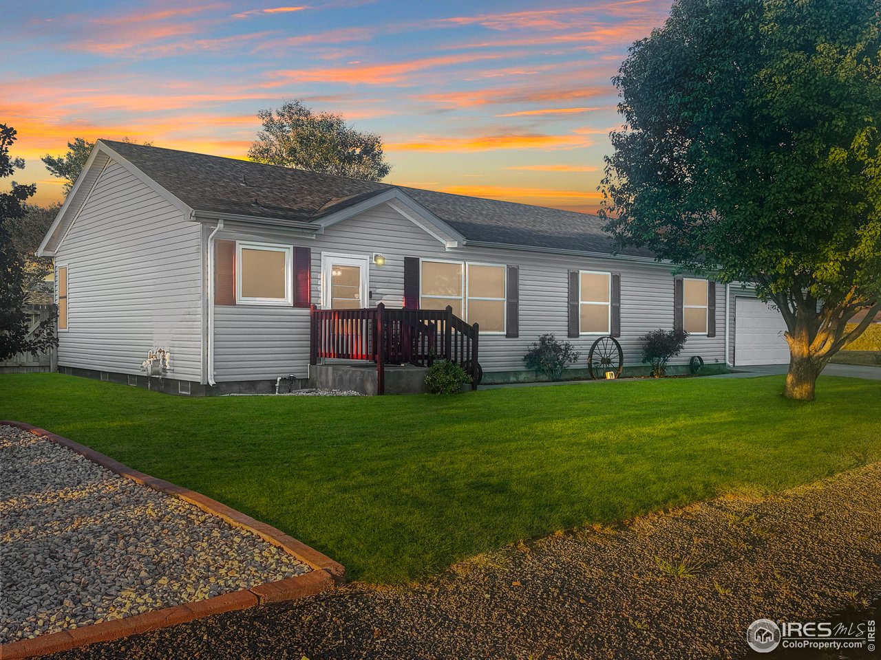 14971 Bluestem Street Sterling, CO 80751 - Photo 2 of 33 a front view of house with yard and green space