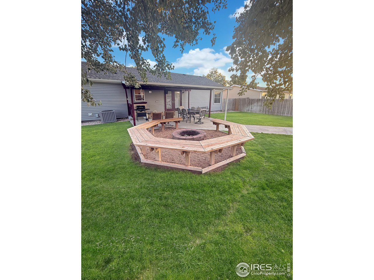 14971 Bluestem Street Sterling, CO 80751 - Photo 25 of 33 a front view of a house with a yard