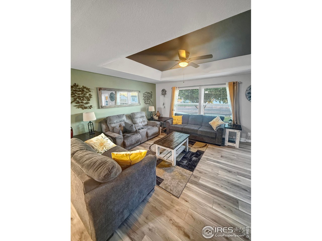 14971 Bluestem Street Sterling, CO 80751 - Photo 6 of 33 a living room with furniture and a window