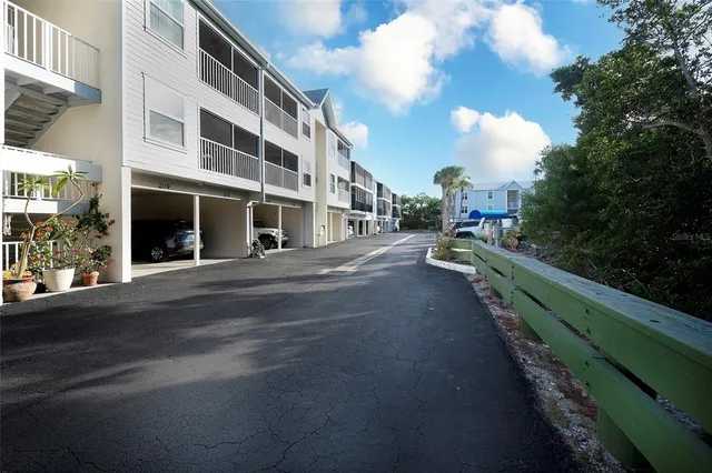 a city street lined with buildings and trees