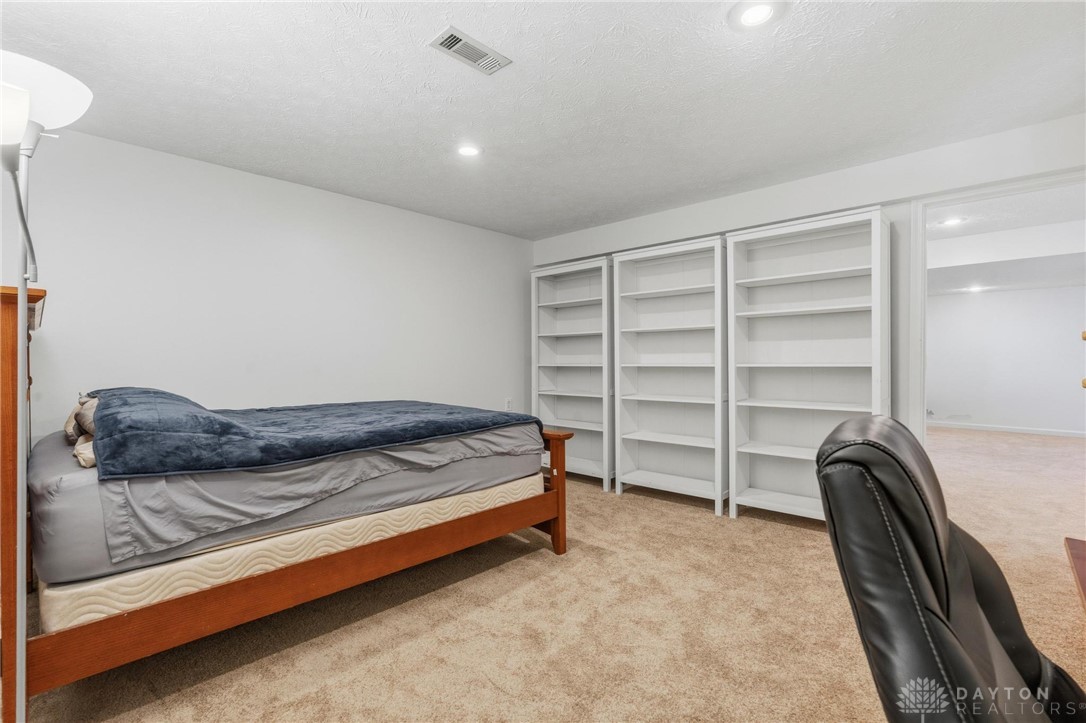 70 Martin Lane Springboro, OH 45066 - Photo 50 of 69 This spacious bonus room offers ample built-in shelving, perfect for storage or display.