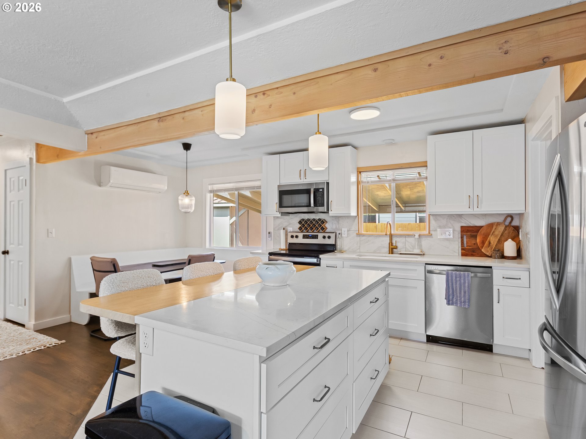 20149 Northeast Oregon Street Fairview, OR 97024 - Photo 11 of 37 a kitchen with stainless steel appliances white cabinets and a refrigerator