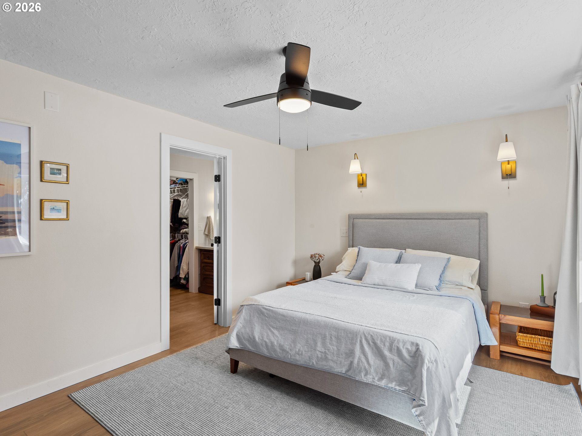 20149 Northeast Oregon Street Fairview, OR 97024 - Photo 20 of 37 a bedroom with a bed and a chandelier