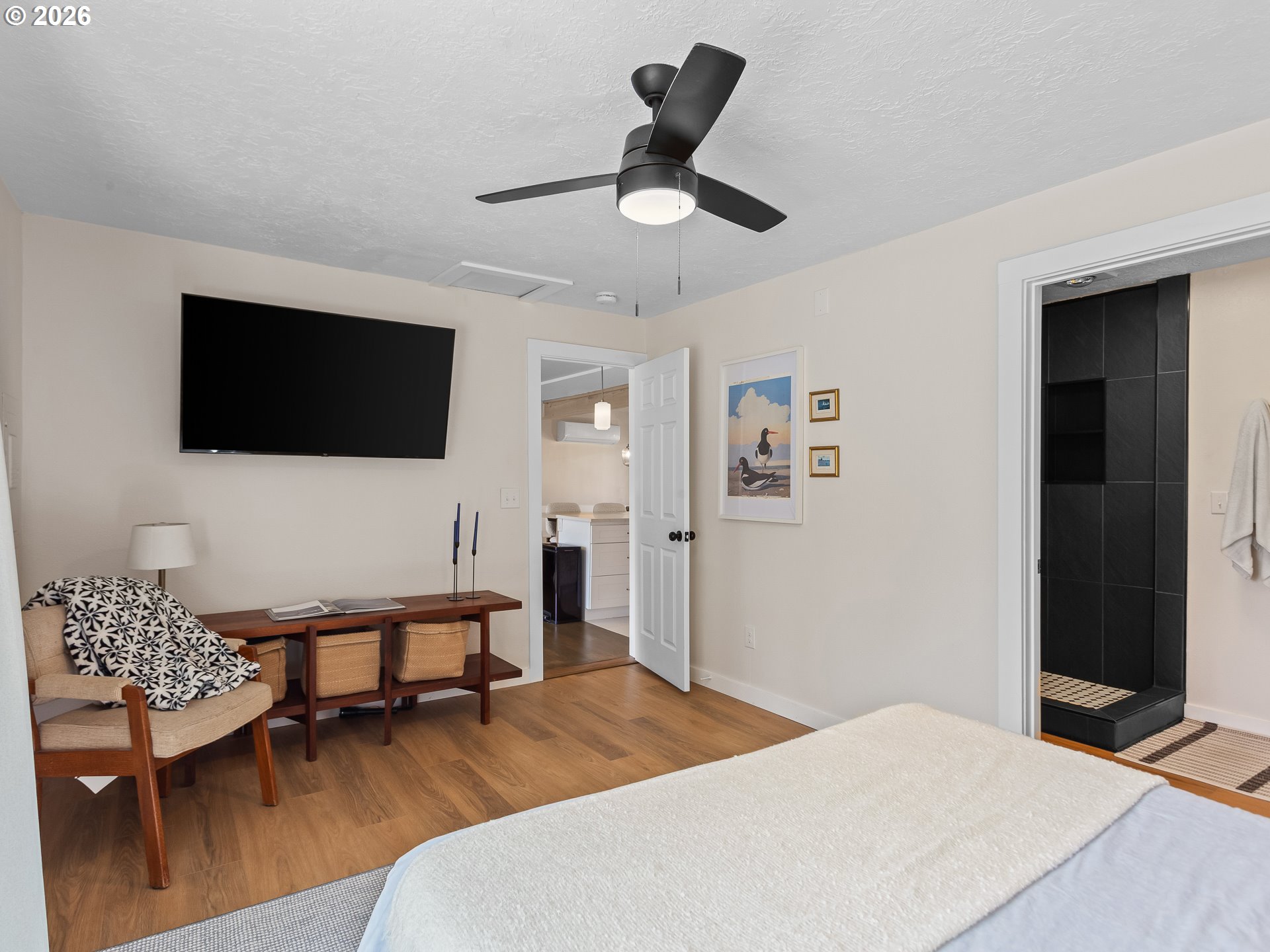 20149 Northeast Oregon Street Fairview, OR 97024 - Photo 21 of 37 a bedroom with a bed and a flat screen tv