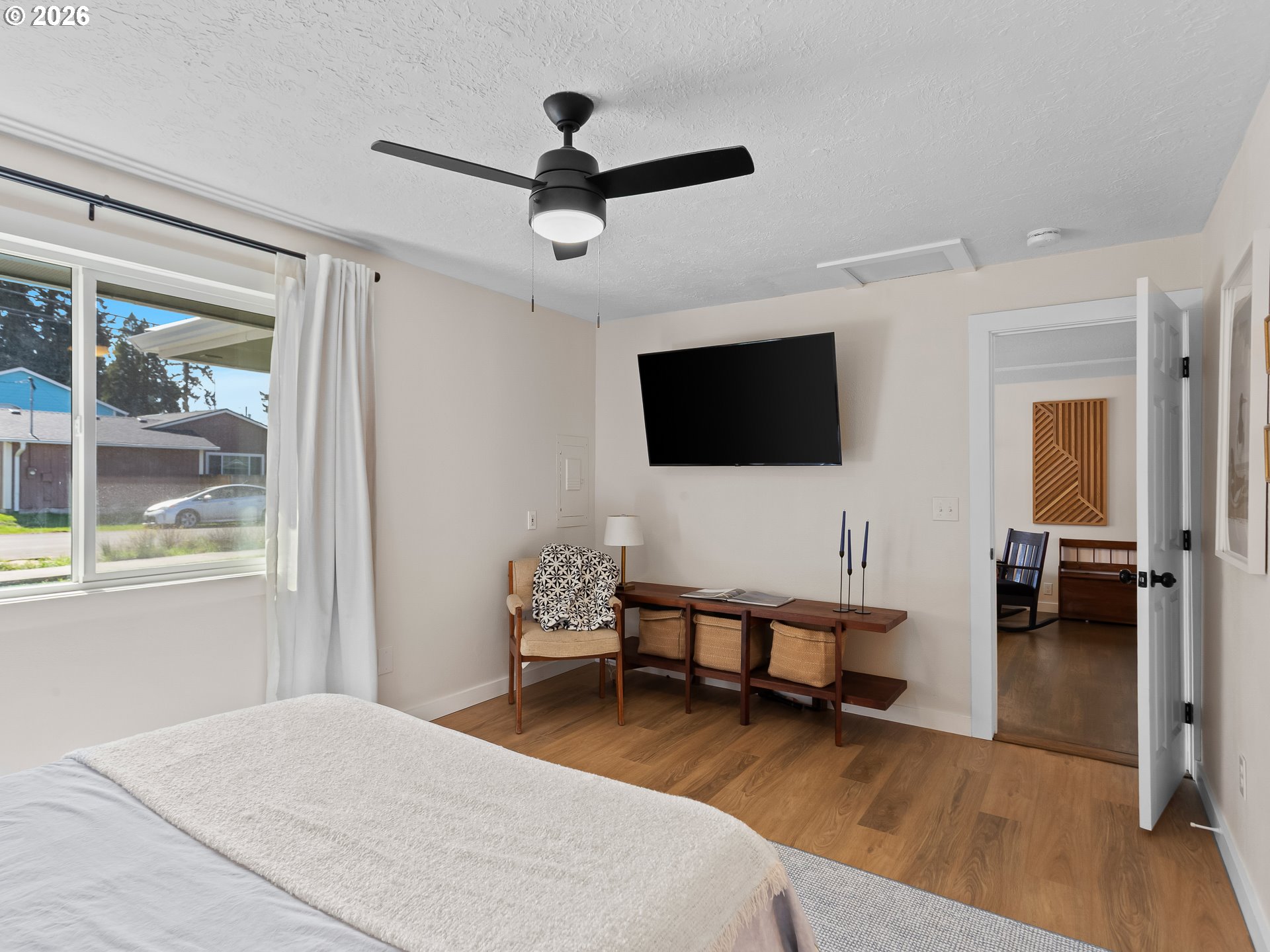 20149 Northeast Oregon Street Fairview, OR 97024 - Photo 22 of 37 a bedroom with furniture and a flat screen tv