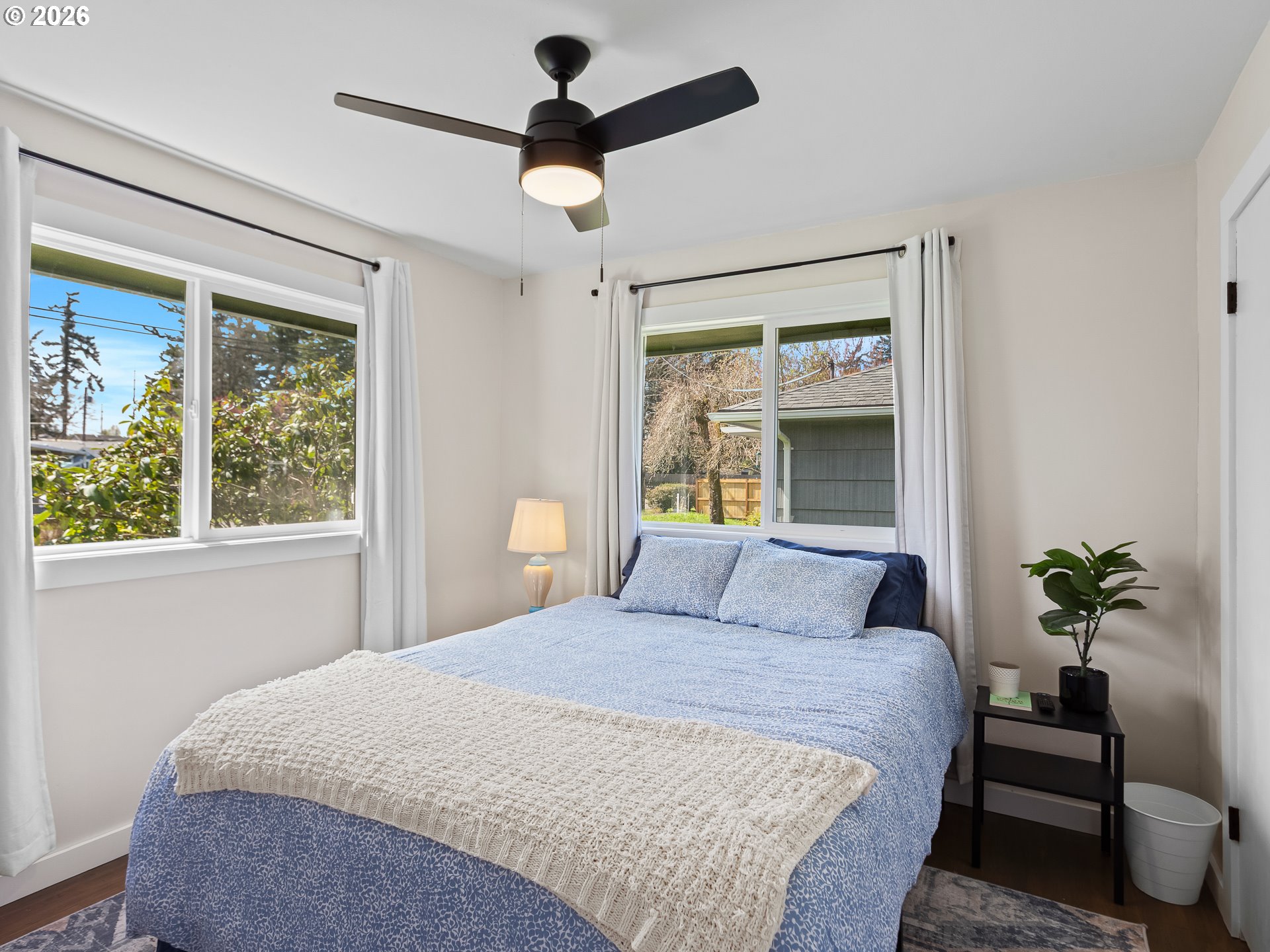 20149 Northeast Oregon Street Fairview, OR 97024 - Photo 27 of 37 a bedroom with a large bed and a window