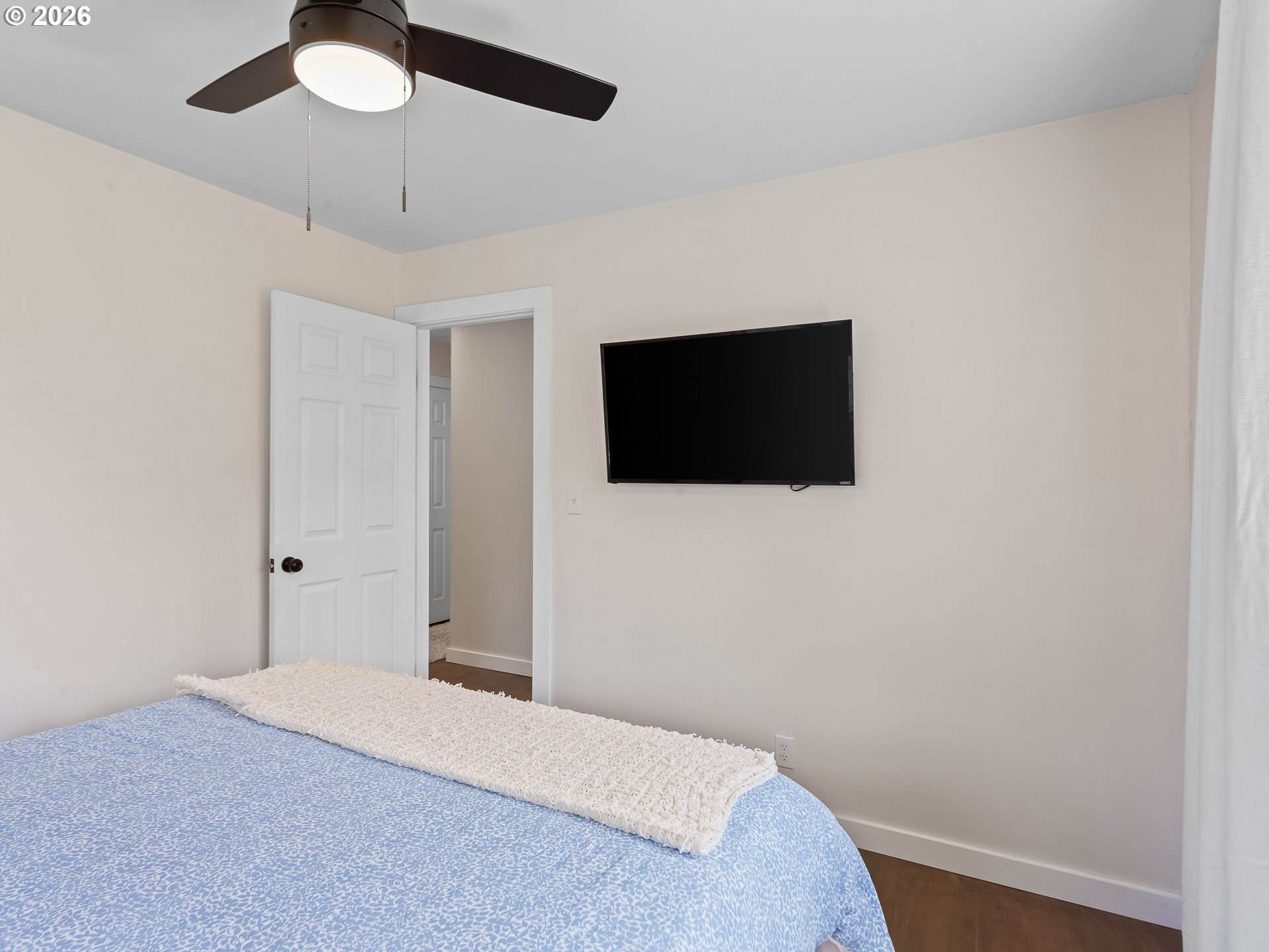 20149 Northeast Oregon Street Fairview, OR 97024 - Photo 28 of 37 a bedroom with a bed and a flat screen tv