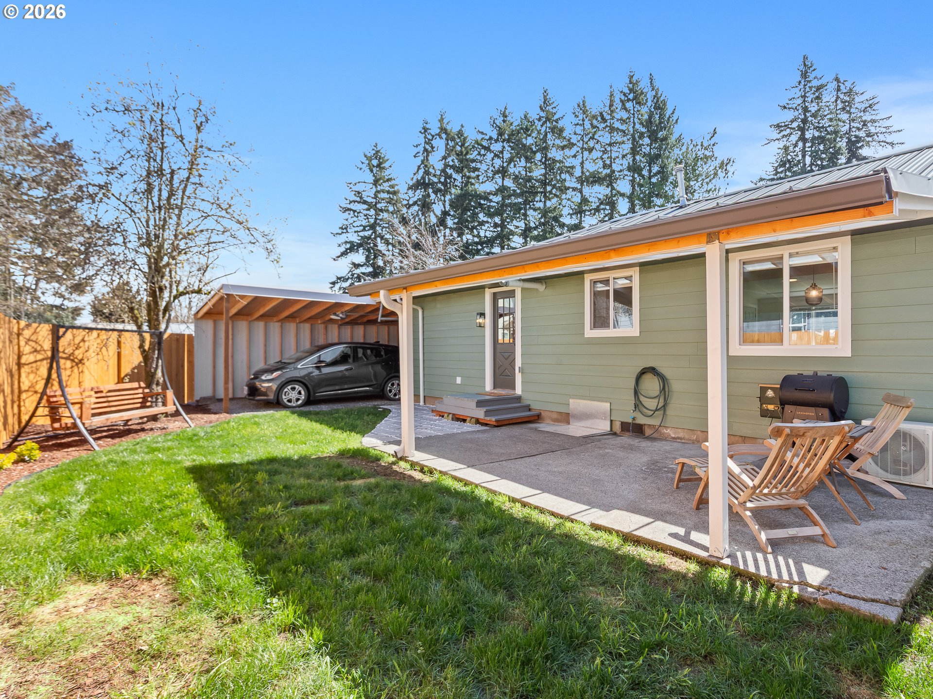 20149 Northeast Oregon Street Fairview, OR 97024 - Photo 34 of 37 a view of a backyard with table and chairs couches wooden floor and a yard